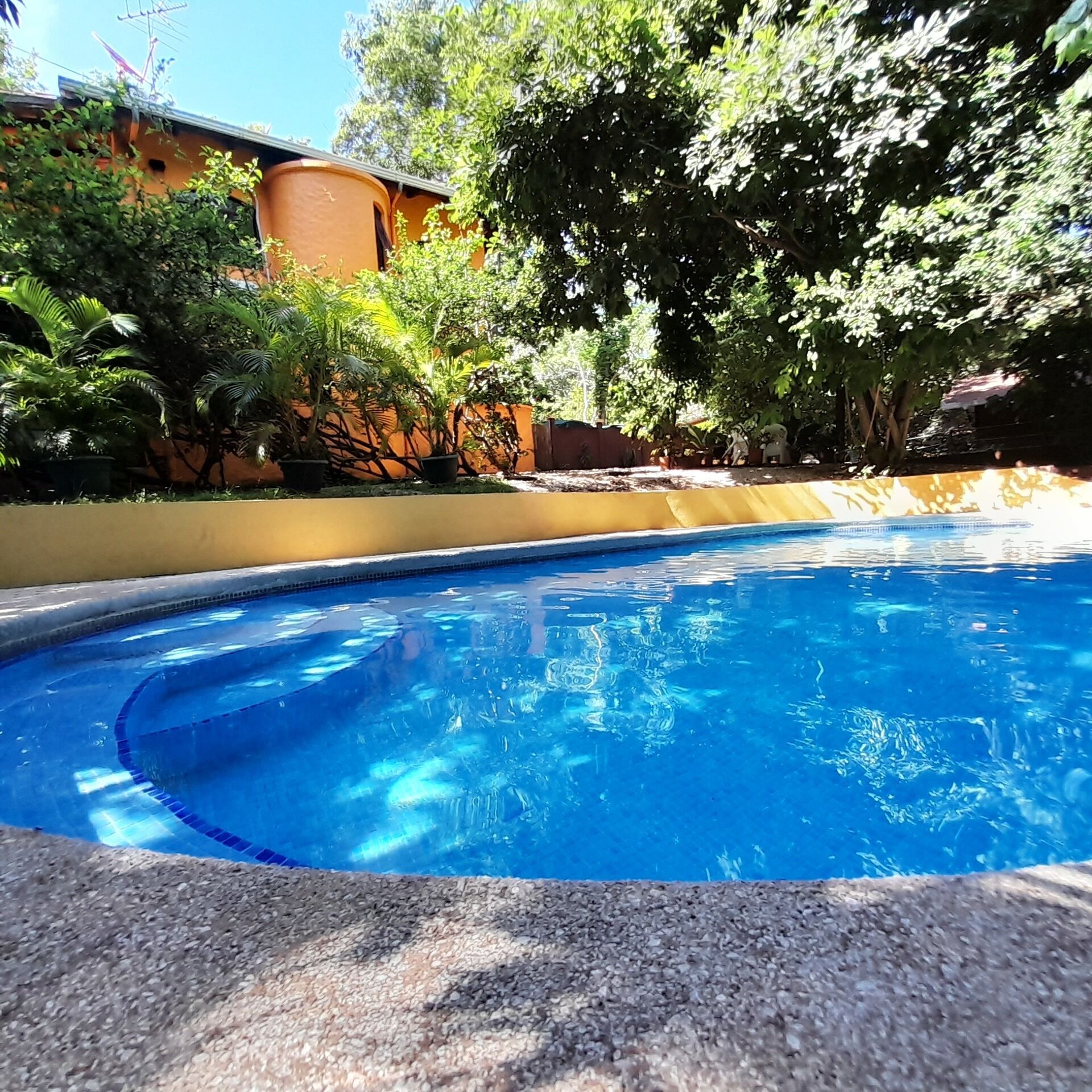 2 outdoor pools, open 7:00 AM to 10:00 PM, pool loungers