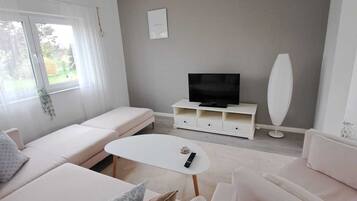 Smart TV, DVD player, foosball, books