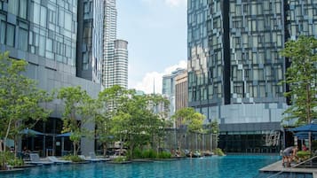 3 outdoor pools, open 7:00 AM to 10:00 PM, pool umbrellas, pool loungers