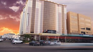 A hotel with a modern facade, multiple floors, and a prominent entrance. - Vandal Hotels (Jizan)
