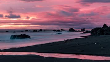 On the beach, black sand