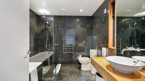 Combined shower/tub, hair dryer, towels, soap