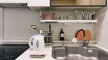 Fridge, microwave, electric kettle, cookware/dishes/utensils