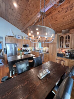 Dining - Sanctuary with a 180-degree view and steps from the sugar sand shoreline.  (Crosslake)