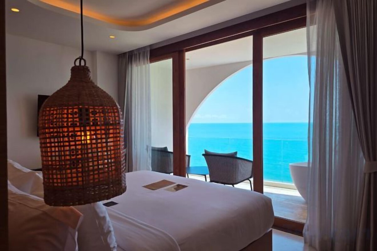 Luxe beddengoed, pillowtop-bedden, een minibar met enkele gratis items