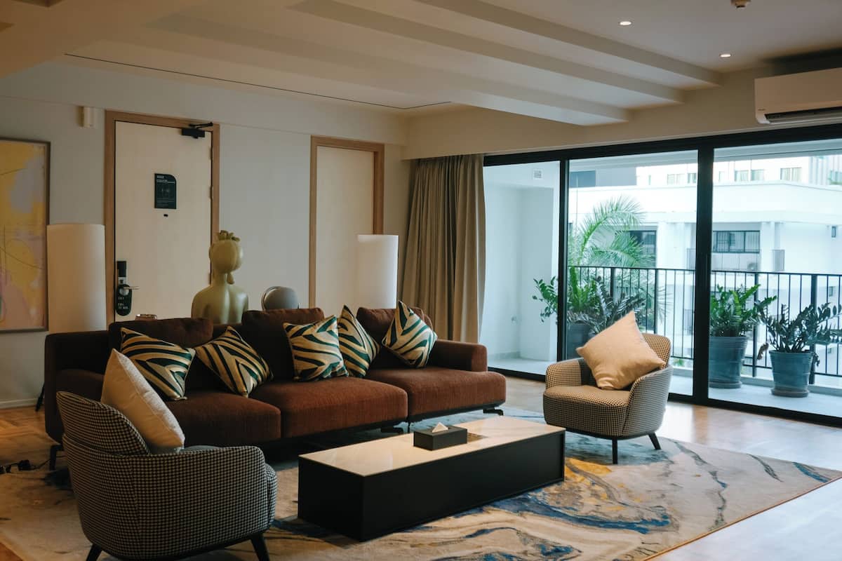 Executive Suite, 3 Bedrooms | Living room | 55-inch flat-screen TV with satellite channels