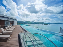 Seasonal outdoor pool, open 9:00 AM to 6:00 PM, pool umbrellas