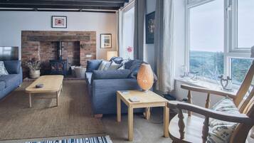 Luxury House | Living area | 32-inch Smart TV with cable channels, fireplace