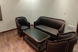 Chambre Deluxe | Coin séjour