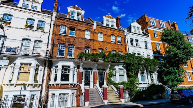 A row of Victorian-style townhouses with distinct architectural features, including bay windows and ornate detailing. - Stylish One Bedroom Flat in Kensingston, London (London)