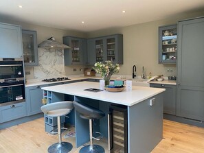 Enjoy casual dining and cooking at the central island with oven and gas stove.