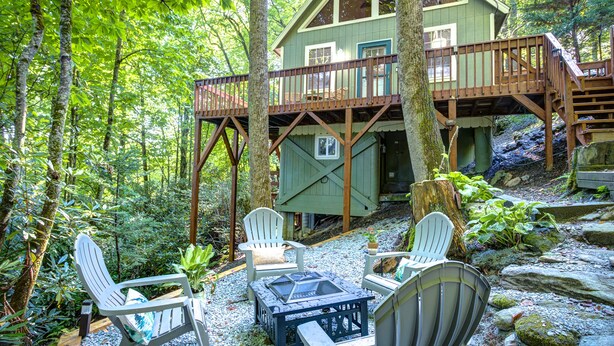 A cabin with a deck, surrounded by trees. - Visit #mytreetophideaway located in Banner Elk, NC, nestled high in the trees.  (Banner Elk)