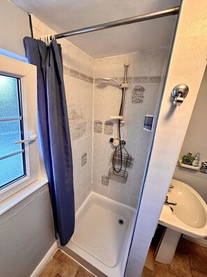 Shower, hair dryer, towels, soap