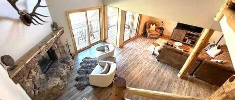 Smart TV, fireplace, books, printers