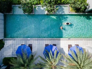Outdoor pool, open 6:00 AM to 8:00 PM, pool umbrellas