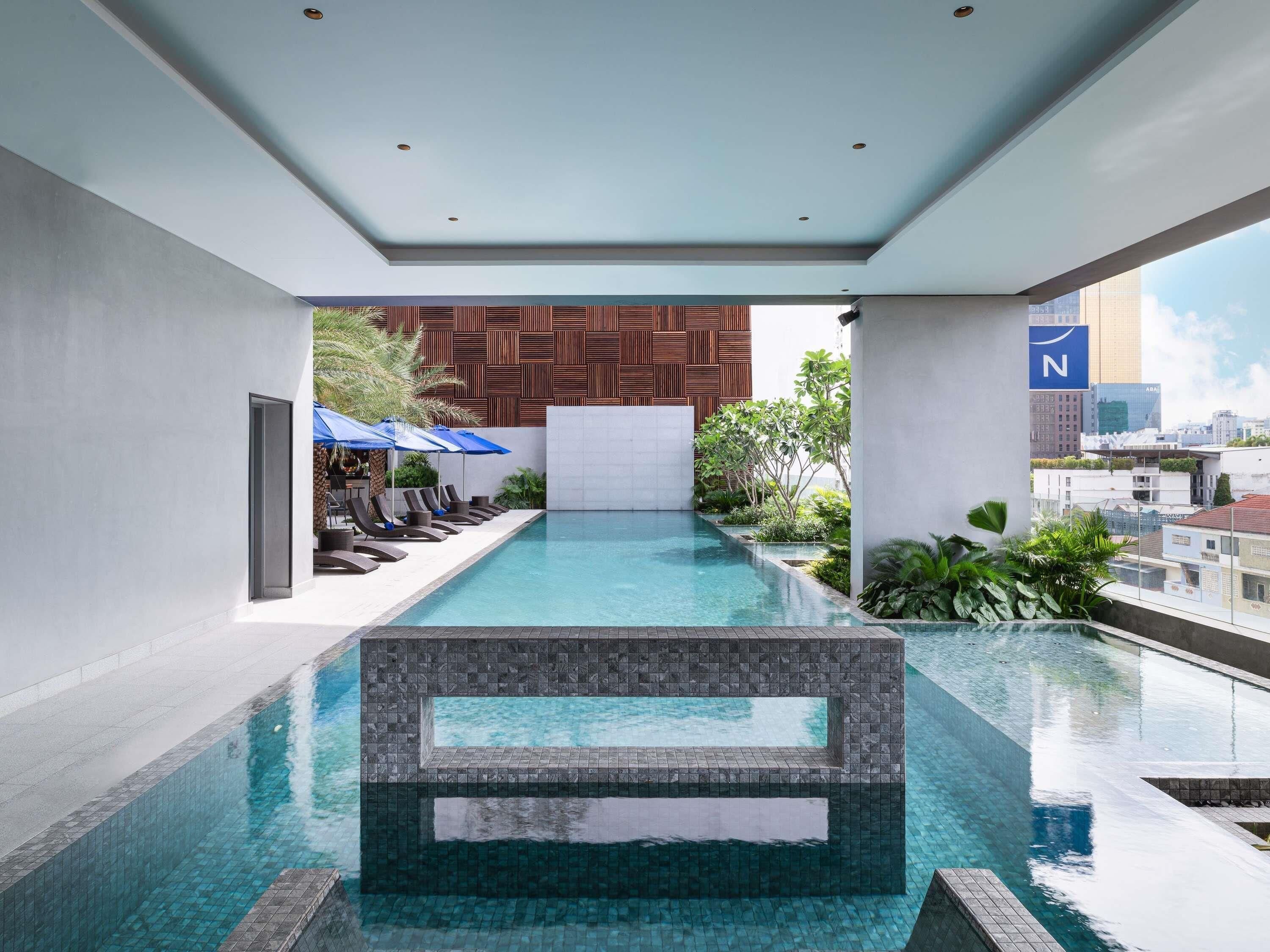 Outdoor pool, open 6:00 AM to 8:00 PM, pool umbrellas