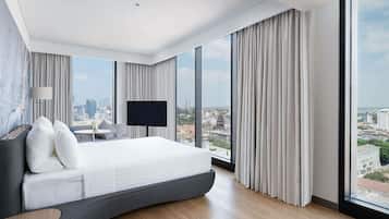 Deluxe Room, 1 King Bed | 1 bedroom, down comforters, minibar, desk