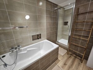 Shower, hair dryer, towels, soap