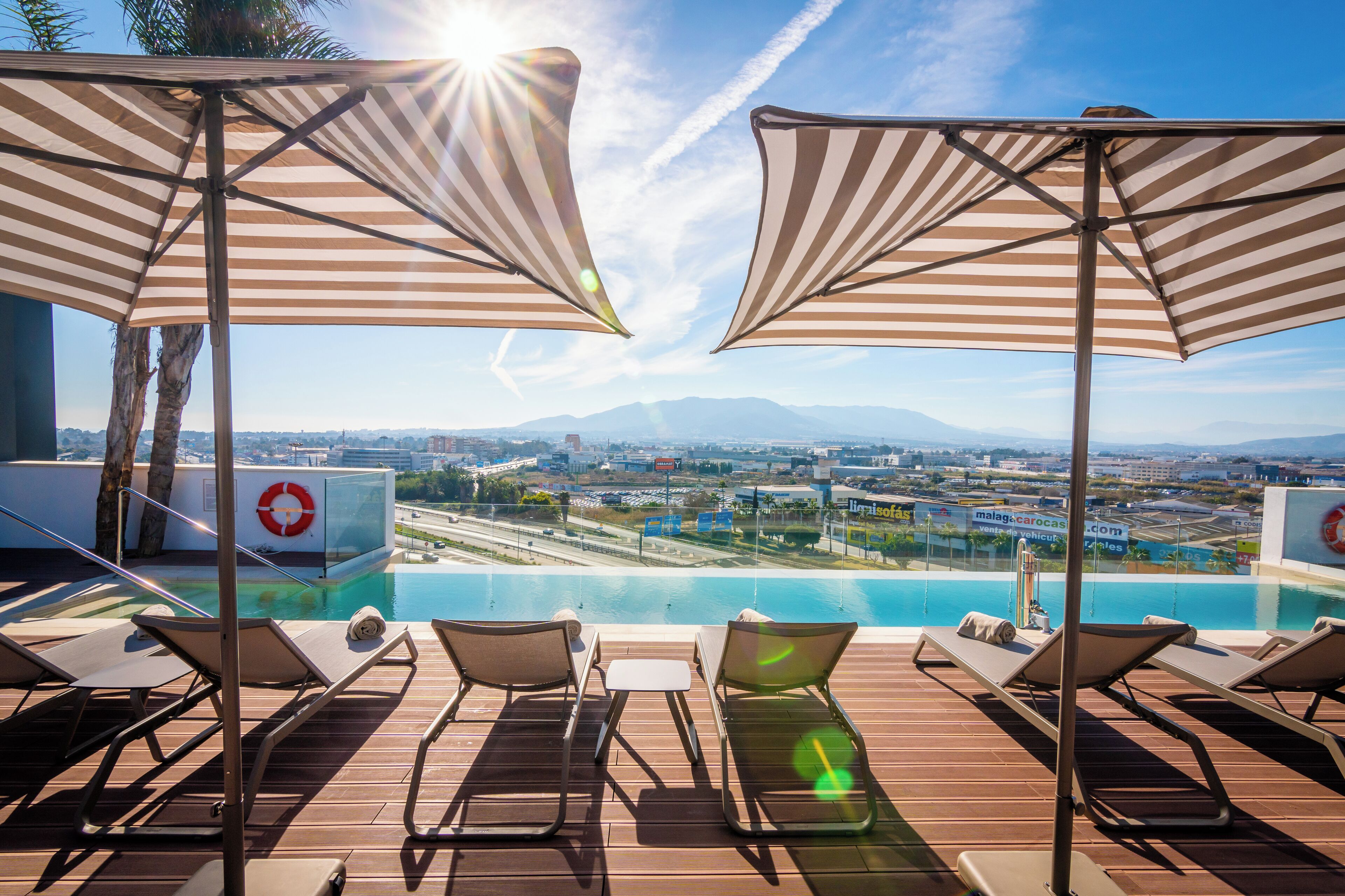 Seasonal outdoor pool, pool umbrellas, pool loungers