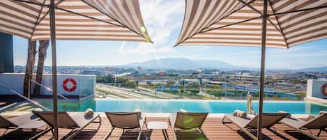 Seasonal outdoor pool, pool umbrellas, sun loungers