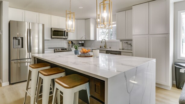 A modern kitchen with a large island, stainless steel appliances, and pendant lighting. - Chehalis Getaway w/ Golf Course View + Fire Pit! (Chehalis)