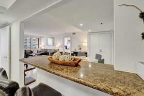 Enjoy a comfortable living space with a kitchen, dining area, and cozy seating.