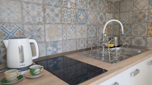 Fridge, oven, electric kettle, cookware/dishes/utensils