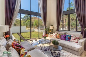 65-inch Smart TV with cable channels - Adora's Place (Coron)