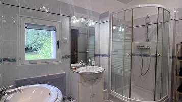 Shower, hair dryer, towels, soap