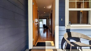 A hallway leading to a room with a view of the outdoors. - Cascade View Haven by Avantstay Saratoga Vistas (Langley)