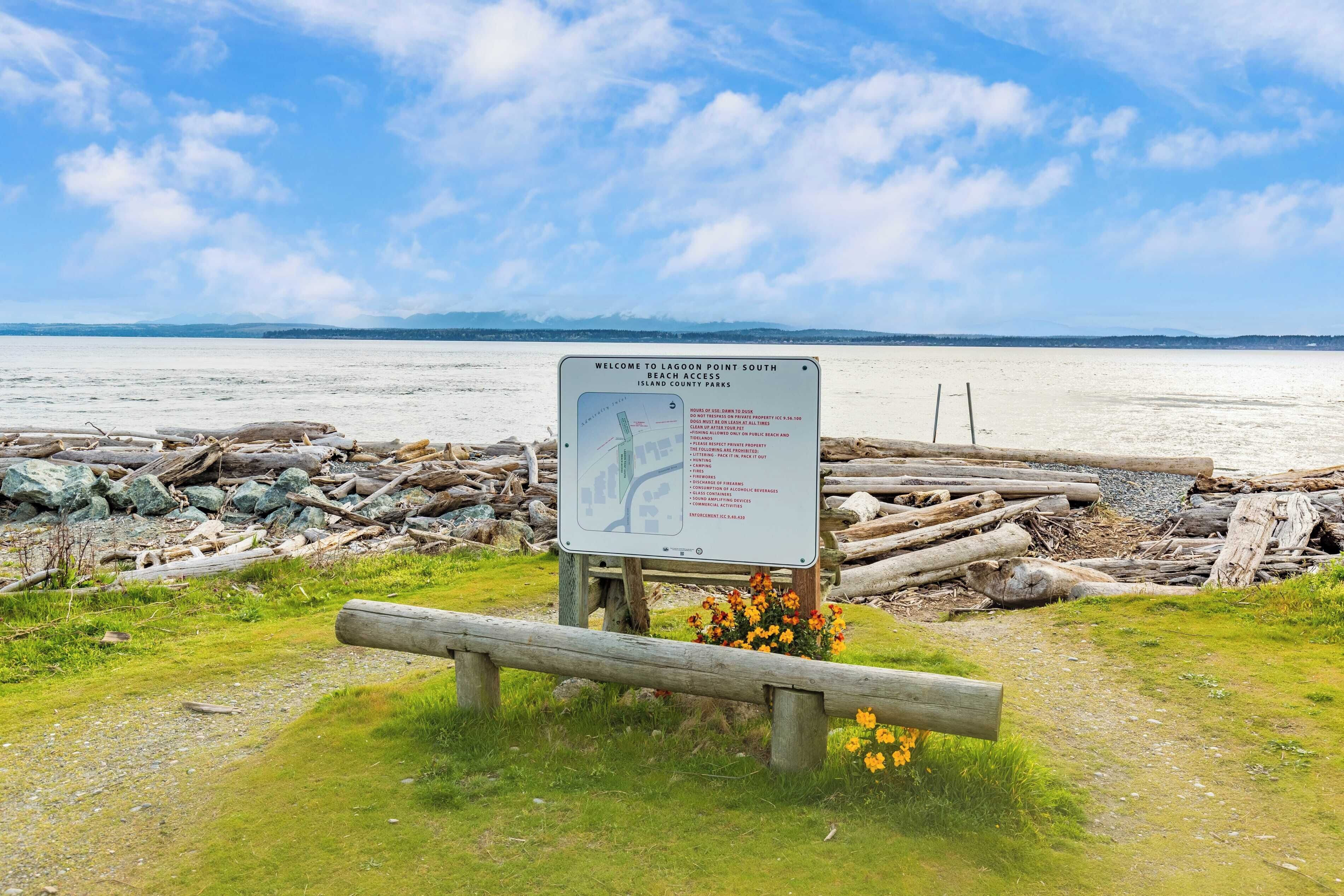 A signboard with a map and regulations for LAGOON POINT SOUTH BEACH ACCESS in Island County Parks.