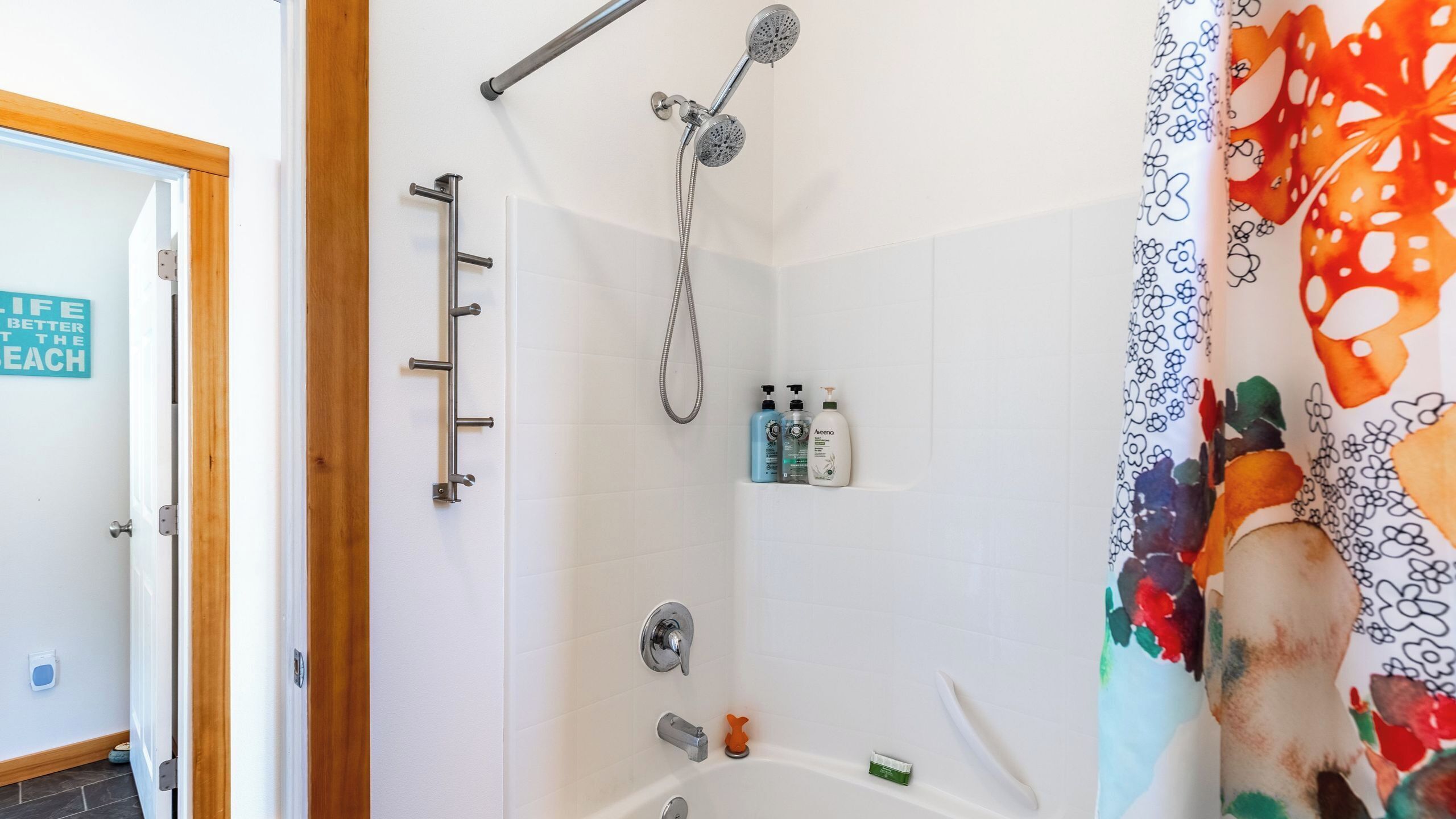 A bathroom with a shower, a bathtub, and a toilet.
