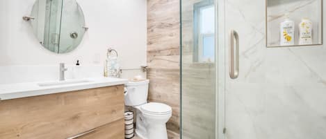 Shower, hair dryer, towels, soap