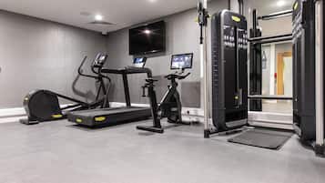 A gym with treadmills, an elliptical, and a weight machine.