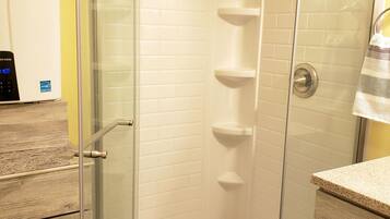 Shower, hair dryer, towels, toilet paper