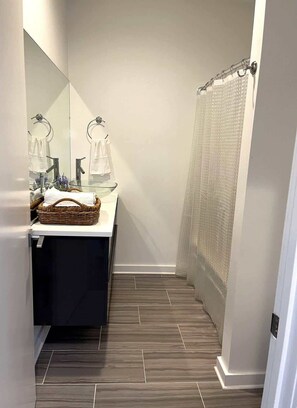 Shower, hair dryer, towels, shampoo