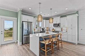 Fridge, microwave, oven, stovetop - Brand New Construction with Private Pool, Elevator & Marsh Views (Oak Island)