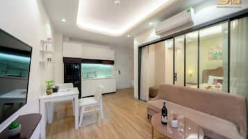 Apartment, 1 Bedroom | Living area | 32-inch LCD TV with digital channels