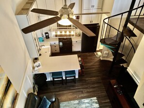 Enjoy a spacious kitchen with a central island and ample counter space, perfect for cooking and dining.