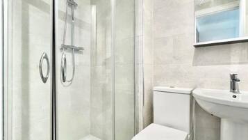 Shower, jetted tub, hair dryer, towels