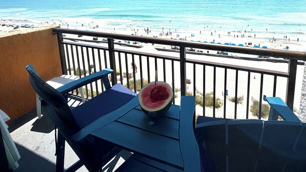 A balcony with a view of a beach and the ocean. - Ocean Front King Suite Landmark Heated pools (Myrtle Beach)