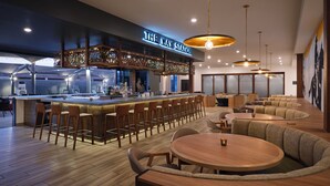 A modern bar area with a bar counter, stools, and seating. - Towneplace Suites By Marriott Tempe (Tempe)