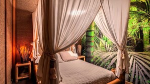 A room with a bed, curtains, a nightstand, and a view of greenery. - Chalet "Bangli" with Private Terrace and Wi-Fi (LACANAU)