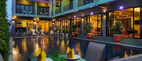 Outdoor pool, open 10:00 AM to 8:00 PM, pool umbrellas, pool loungers