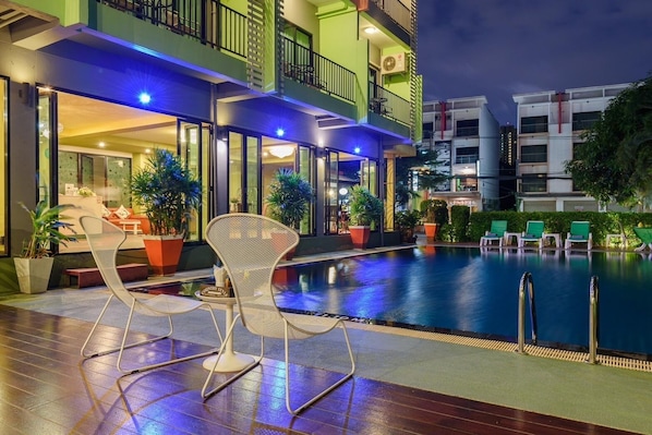 Outdoor pool, open 10:00 AM to 8:00 PM, pool umbrellas, pool loungers