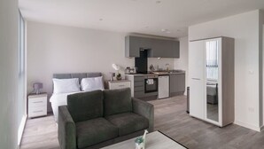 A modern apartment with a living room, a kitchenette, a bedroom, and a bathroom. - Fabulous Studio in Central Liverpool (Liverpool)