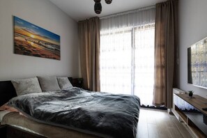 1 habitación, tabla de planchar con plancha, wifi gratis y ropa de cama 