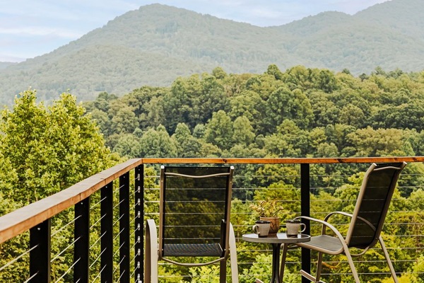 Start your day with coffee and mountain views from this peaceful deck perch, rockers included.