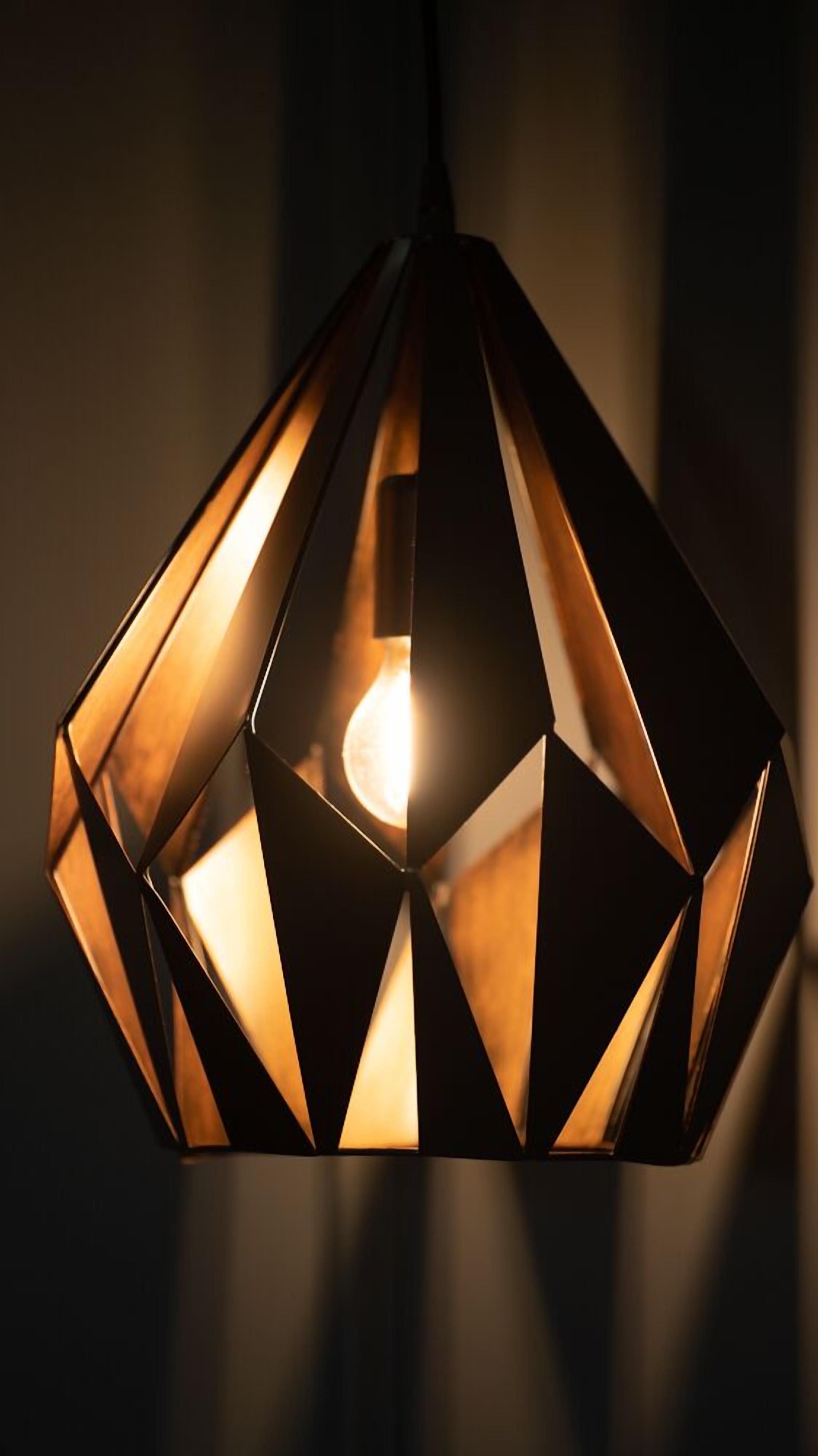 A geometric pendant light fixture with a central bulb.