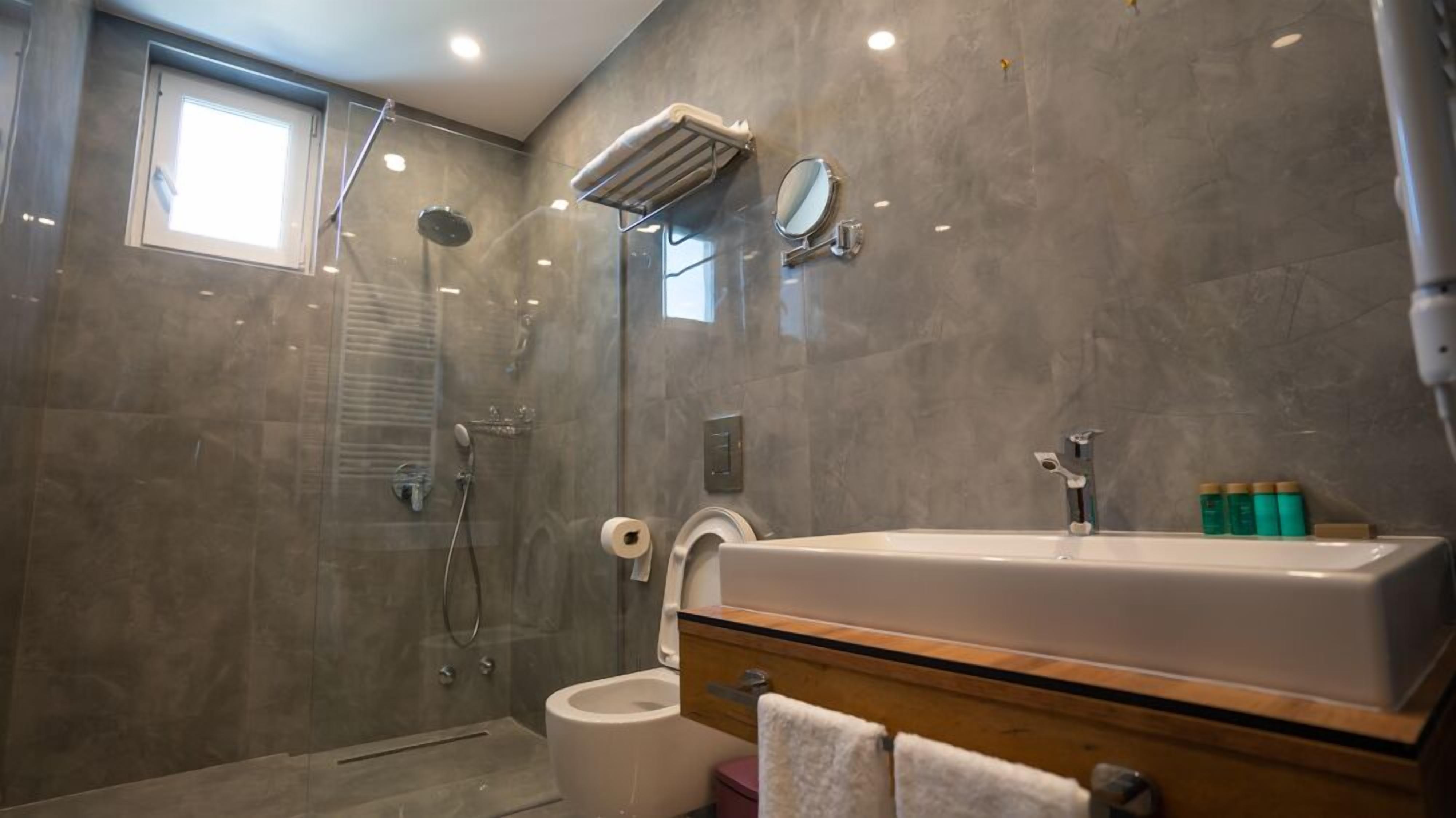 luxury suite | bathroom | free toiletries, hair dryer, bathrobes, slippers